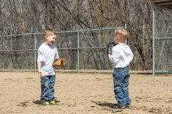 boys-playing-baseball-two-young-standing-field-catch-39002788